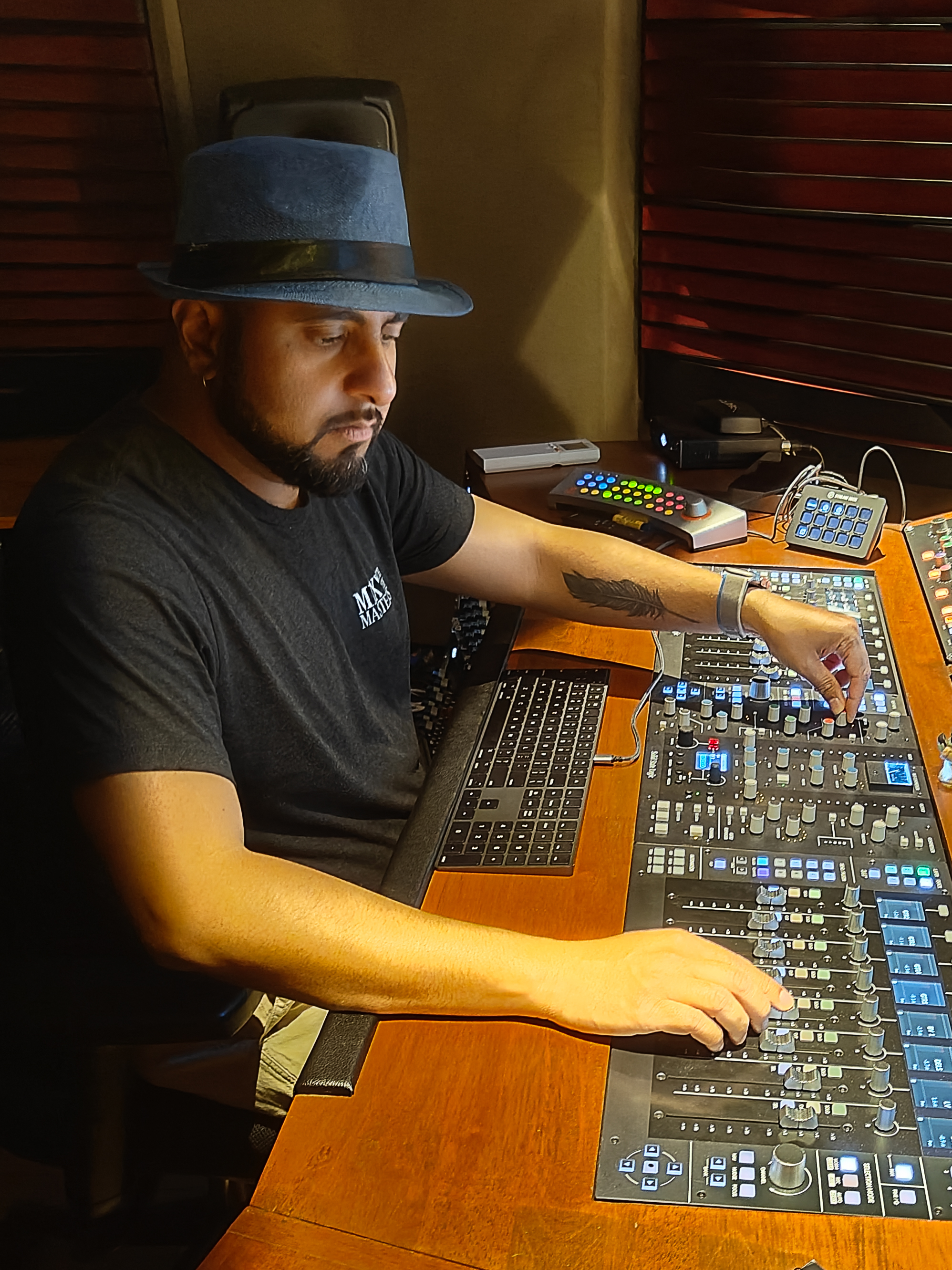 An engineer working at the mixing desk